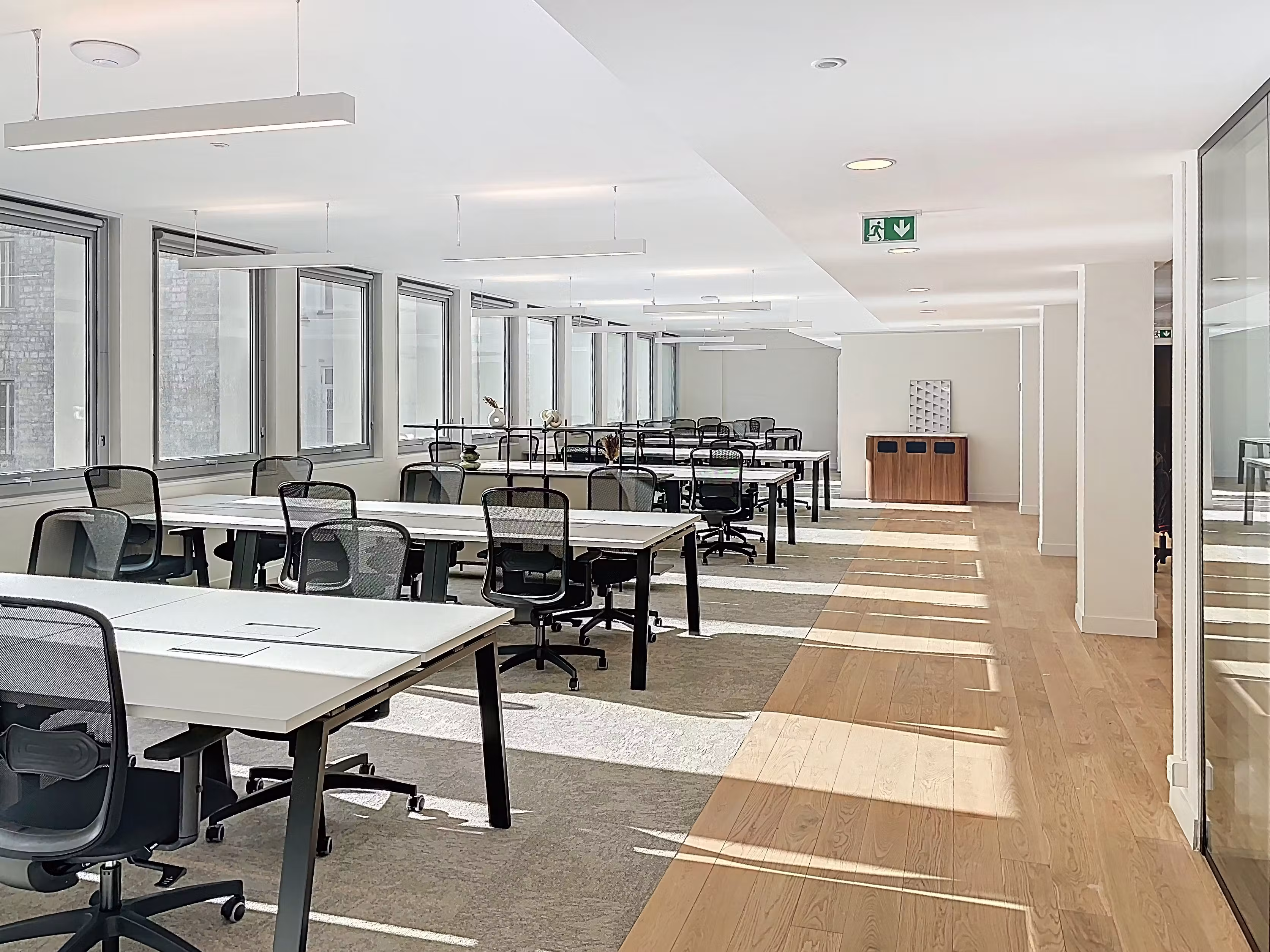 RentDesk office rental planning table with workspace layouts and business planning materials