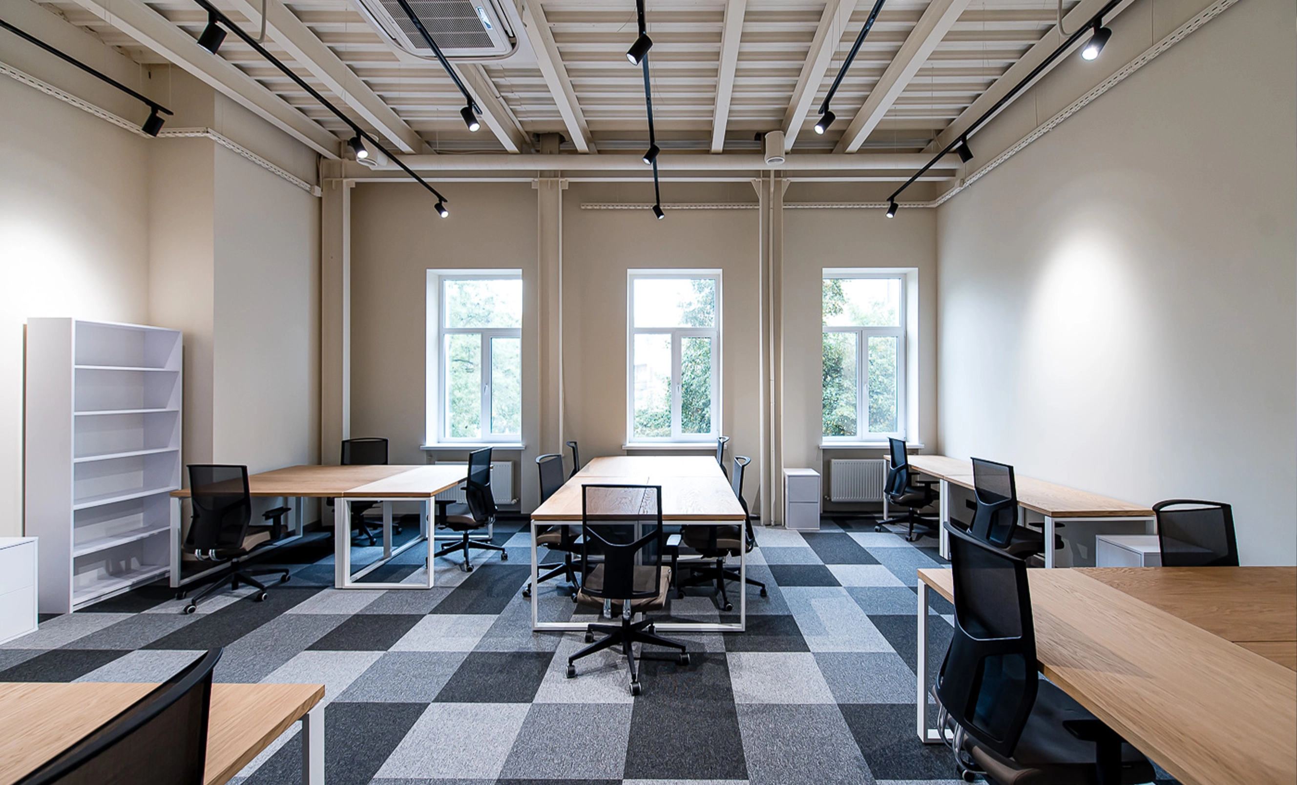 Professional office workspace with organized desks, private areas and a carefully planned business layout