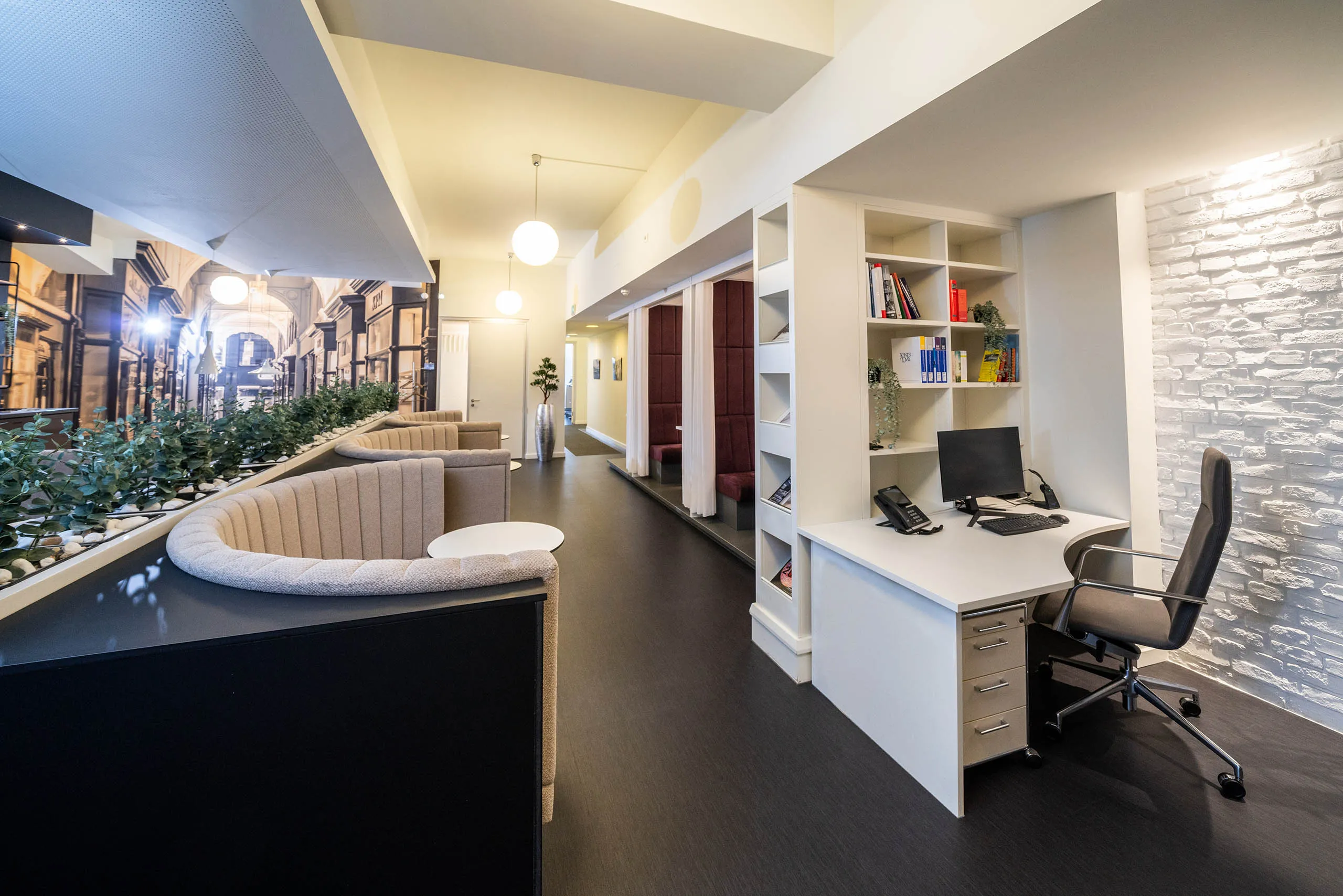 Professional office workspace with layered work areas and a practical business environment