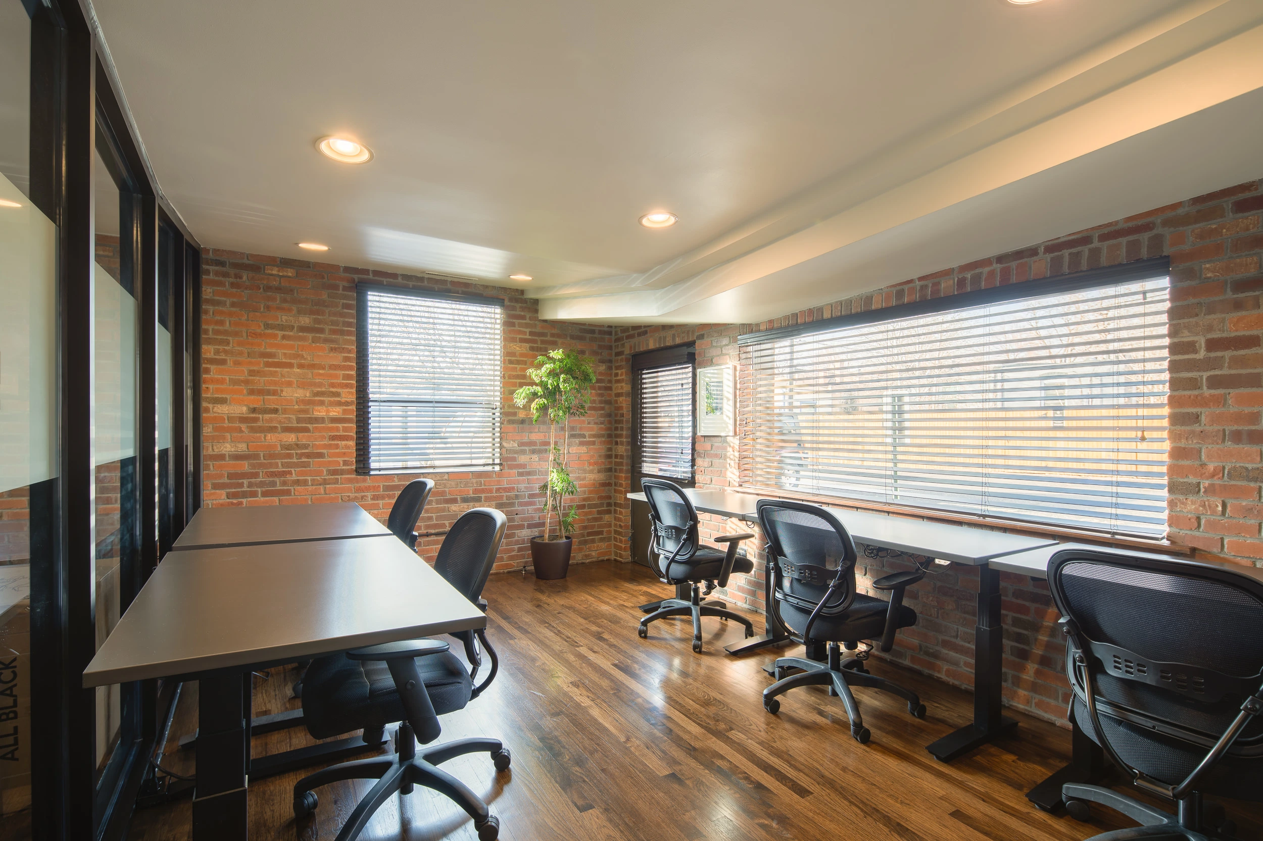 Professional meeting office with conference table, comfortable seating and connected workspace