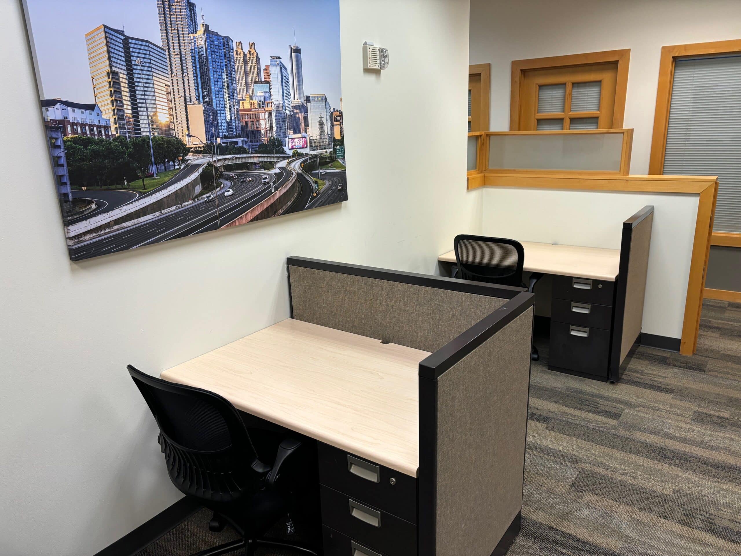 Professional office lounge and meeting area with comfortable seating and connected workspace